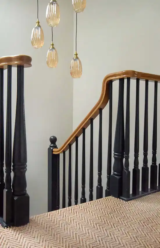 stairs with black bannisters